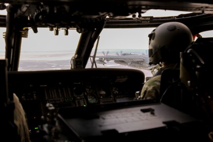 Alaska Air National Guardsmen with the 210th Rescue Squadron maneuver an HH-60G Pave Hawk helicopter into position for an air-to-air refuel from a 211th RQS HC-130J Combat King II aircraft over the Lower Susitna Valley near Anchorage, Alaska, Feb. 7, 2023. Both aircraft along with rescue personnel from the 212th RQS sit alert for the federal search and rescue mission across Alaska’s vast Arctic region. The HC-130J’s aerial refueling capability significantly extends the HH-60G Pave Hawk’s range for conducting search and recovery missions.