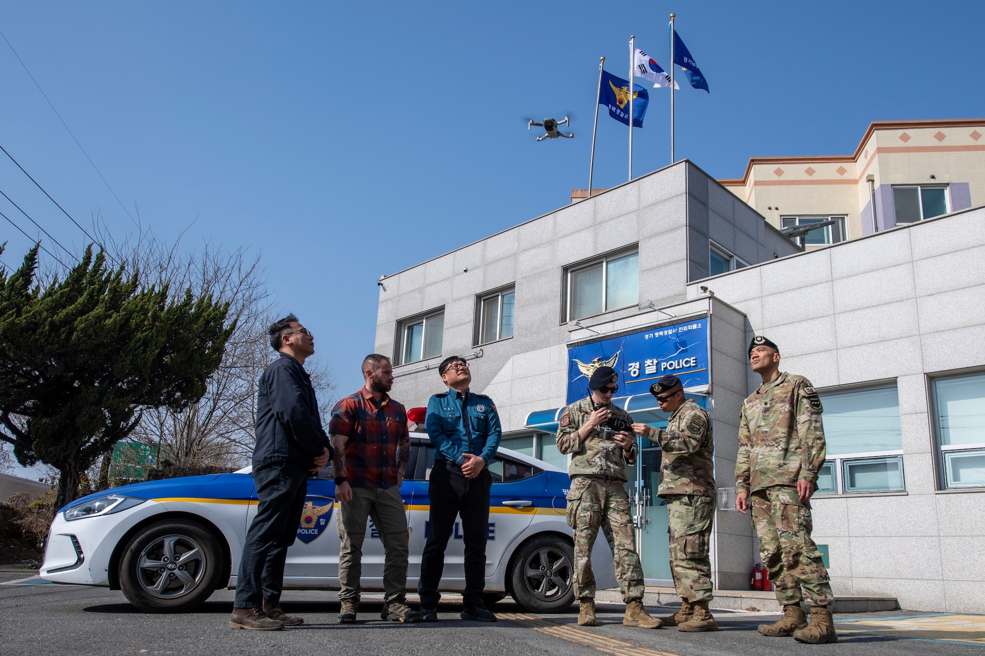Members of the 51st Security Forces Squadron (SFS), 7th Air Force, Force Protection Division, Air Force Offices of Special Investigation (AFOSI) and Korean National Police (KNP) fly a small unmanned aircraft system (sUAS), March 22, 2023, during a bilateral counter sUAS exercise outside of Osan Air Base, Republic of Korea.