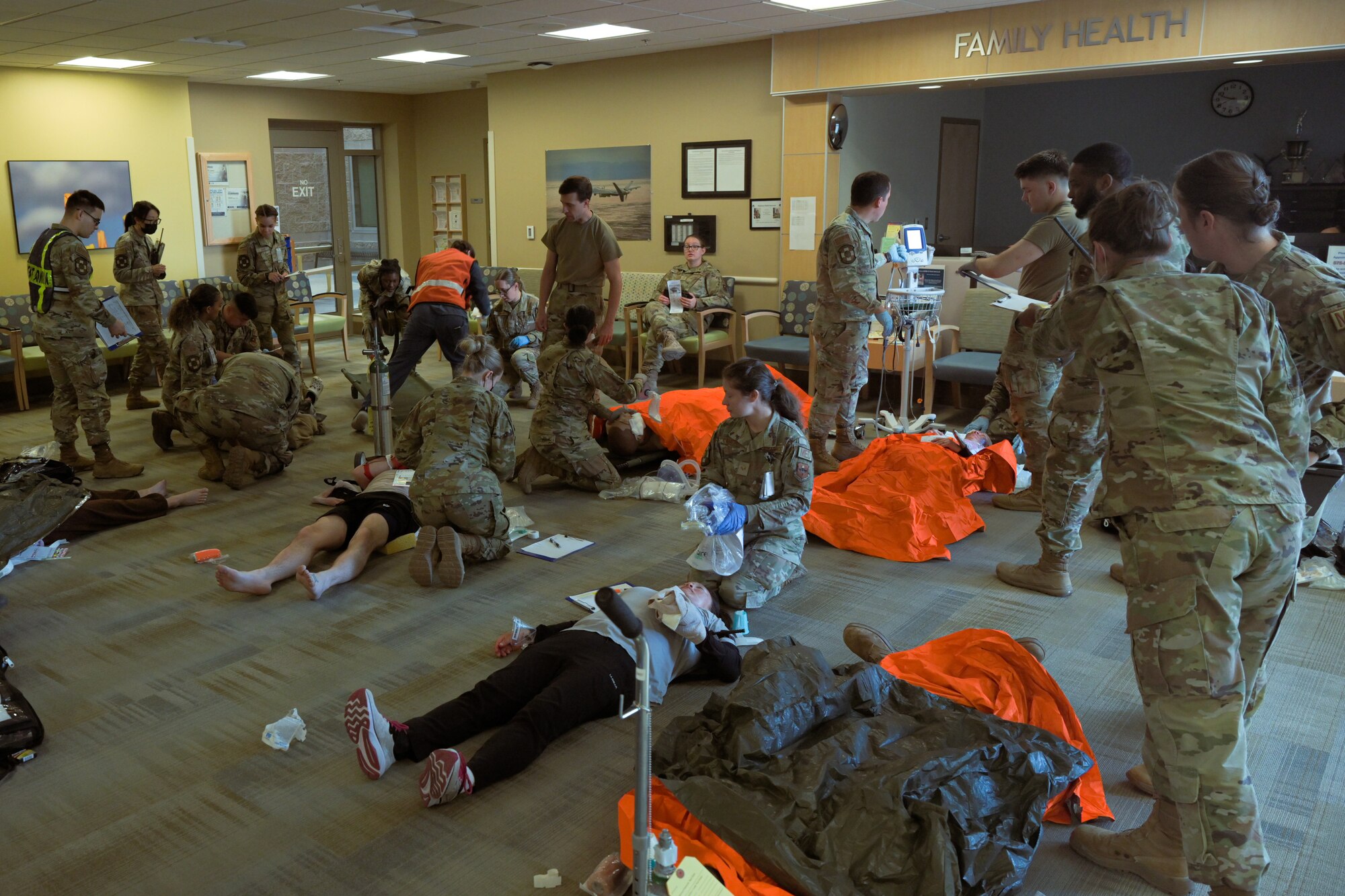 Members from the 49th Medical Group prepare a patient to be transported during a Ready Eagle exercise at Holloman Air Force Base, New Mexico, March 30, 2023. The initial response teams were responsible for on-the-scene care and patient transport. (U.S. Air Force by Senior Airman Antonio Salfran)