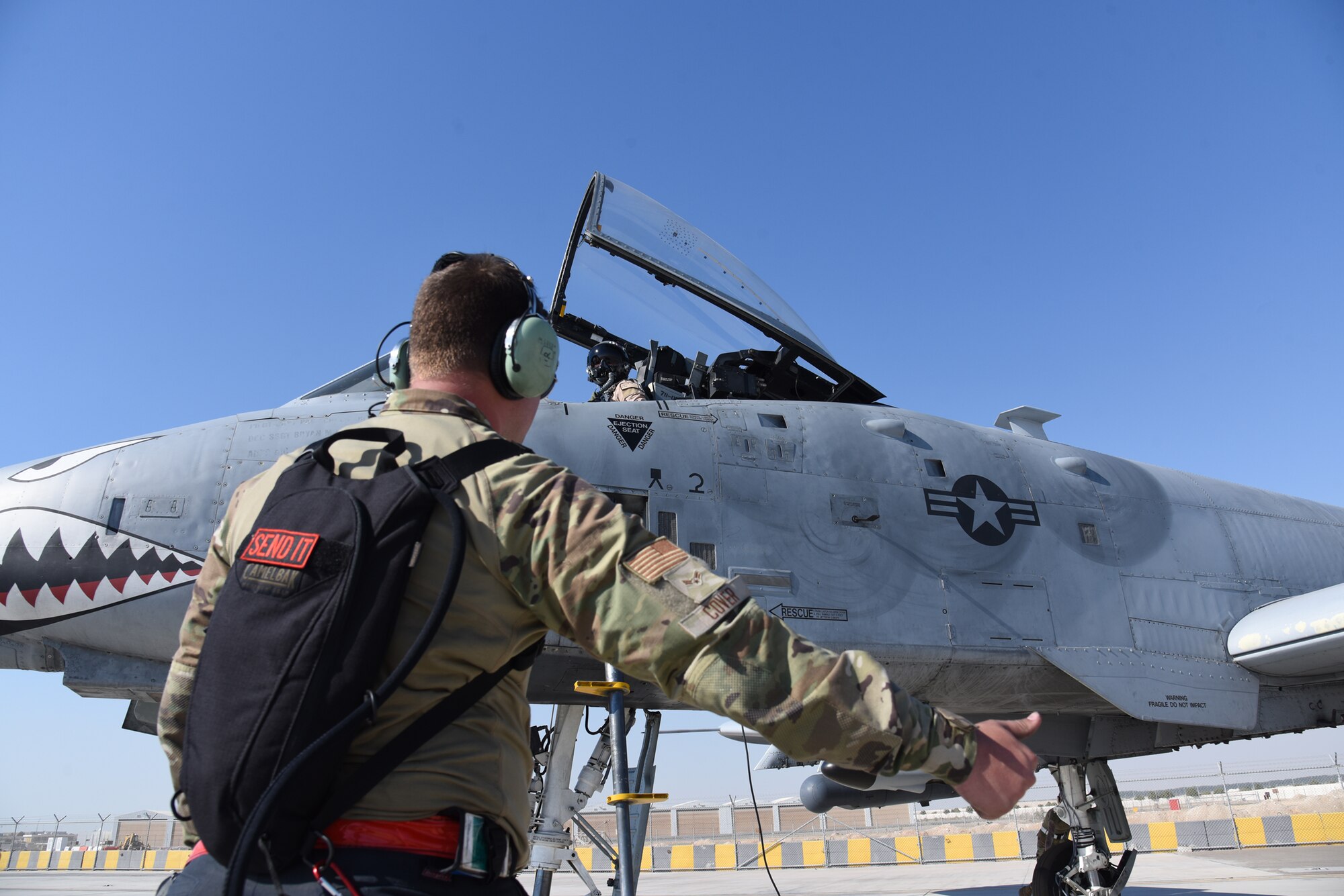 U.S. Air Force Airman First Class Matthew Cover, 75th Expeditionary Fighter Generation Squadron crew chief, prepares a U.S. Air Force A-10 Thunderbolt II for the first sortie at Al Dhafra Air Base, United Arab Emirates, April 6, 2023. The deployment of the A-10 offers the opportunity for U.S. Air Forces Central Command (AFCENT) to experiment with close air support capabilities in order to achieve the most robust, diverse force possible. (U.S. Air Force photo by Tech. Sgt. Chris Jacobs/released)