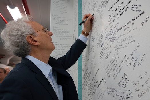  U.S. Ambassador to the Kingdom of Denmark Alan Leventhal signs the 12th Space Warning Squadron heritage wall during his visit to Pituffik Space Base, Greenland, April 6, 2023. Leventhal participated in the Pituffik Space Base renaming ceremony. The renaming better reflects the base’s role in the U.S. Space Force, while paying homage to its ties to the Greenlandic people and culture. (U.S. Space Force photo by Senior Airman Kaitlin Castillo)