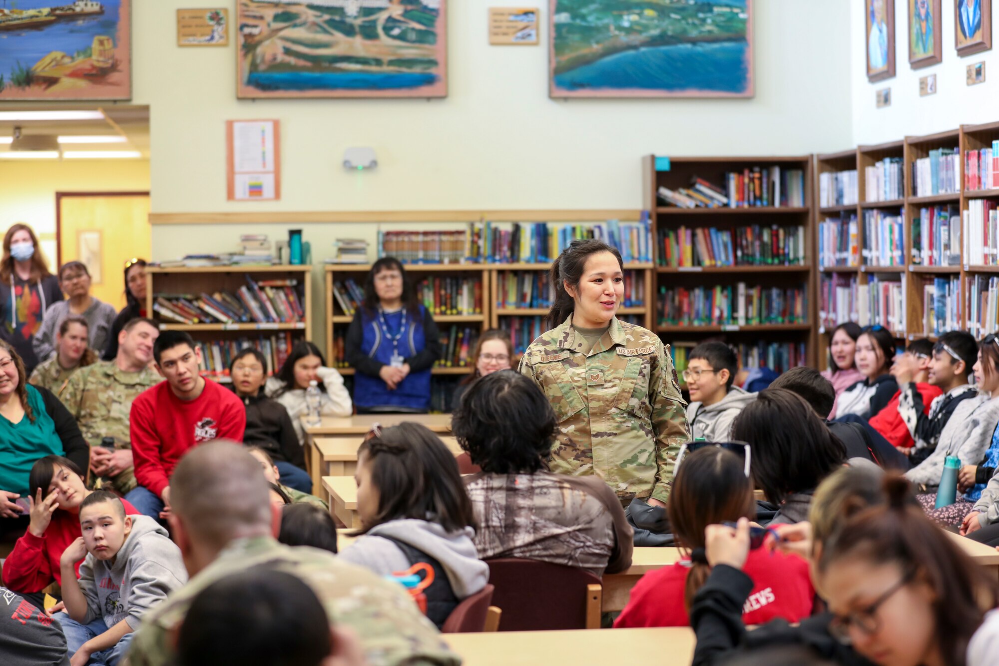 Alaska Air National Guard Staff Sgt. Sharon Queenie, a surveillance technician with the 176th Air Defense Squadron, gives a presentation to students from her hometown of St. Mary’s, Alaska, during a recruiting initiative in partnership with the Association of Village Council Presidents at the Andreafski High School, March 31, 2023. The Association of Village Council Presidents recently partnered with the Alaska National Guard to provide recruiting information and resources through their Tribal Job Centers. The initiative kicked off in St. Mary’s with presentations from AVCP and AKNG, where representatives interacted with students, parents, teachers, and community members. AVCP provides community development, education, social services, culturally relevant programs, and advocacy for the people and 56 tribes of Western Alaska.