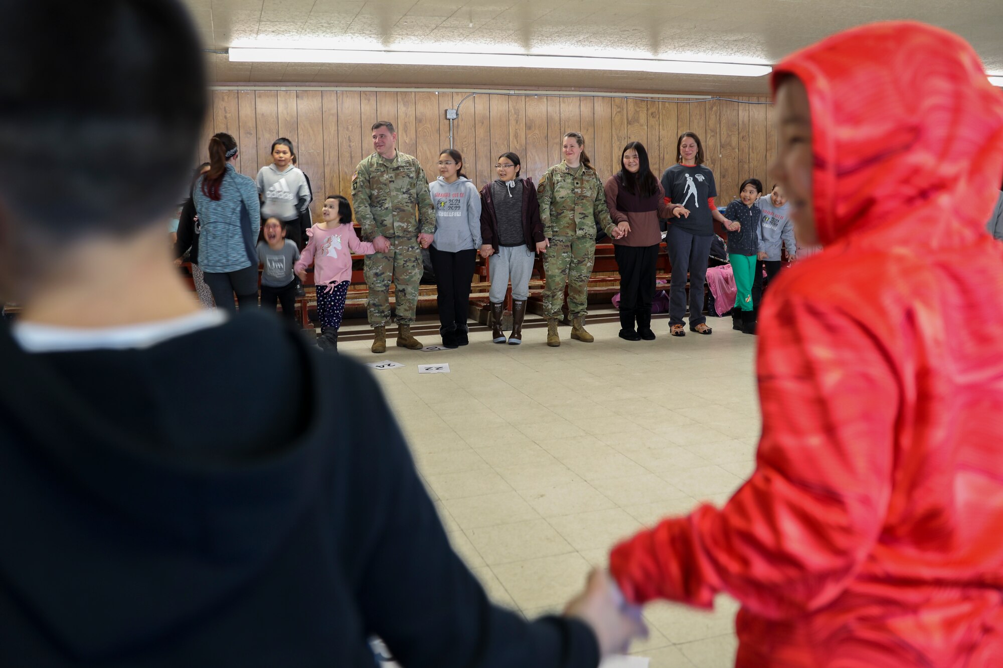 Community members and Alaska National Guardsmen enjoy a night of games hosted by the Roses of Andreafski, a local girls club in St. Mary’s, Alaska, March 31, 2023. The Association of Village Council Presidents invited the Guardsmen to speak with students, parents, teachers, and community members at the Andreafski High School earlier in the day. The AVCP recently partnered with the Alaska National Guard to provide recruiting information and resources through their Tribal Job Centers.