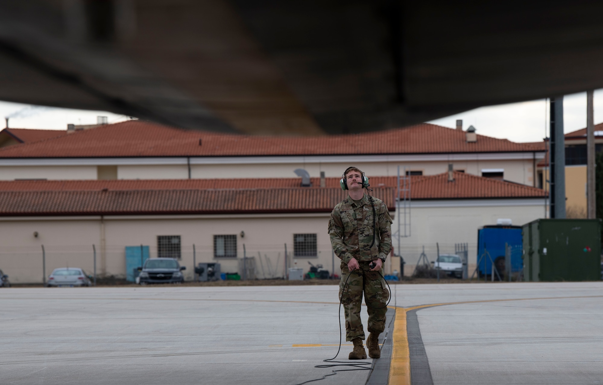 U.S. Air Force Reserve Senior Airman Carsen Scribner, 465th Air Refueling Squadron KC-135 crew chief, performs preflight checks on a KC-135 Stratotanker during a total force training event