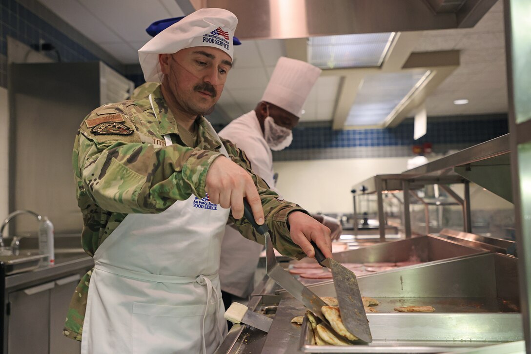 Airman with moustache serves food