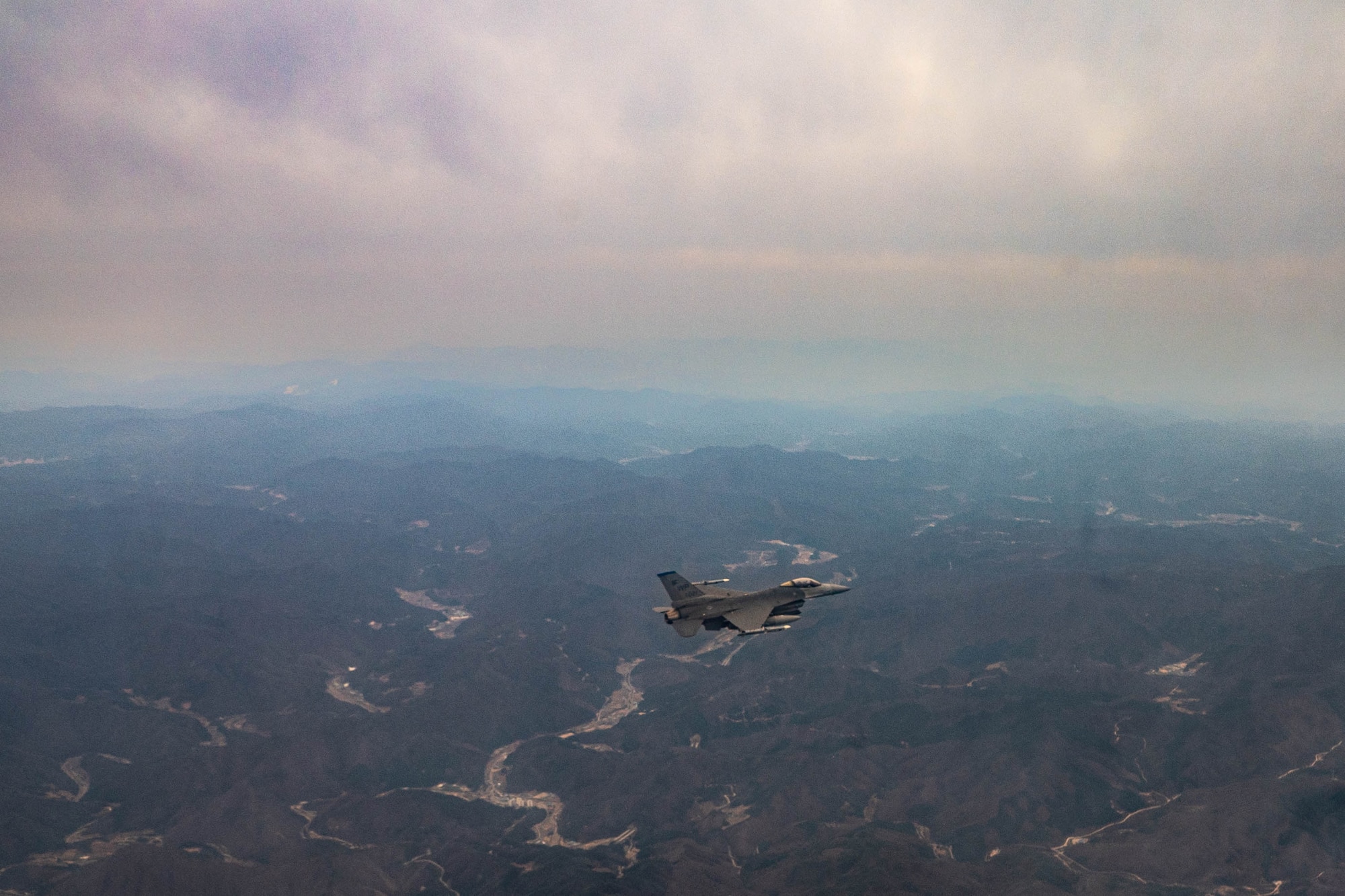 An F-16 Fighting Falcon assigned to the 8th Fighter Wing, Kunsan Air Base, Republic of Korea, flies over the Korean Peninsula, April 4, 2023. The F-16 entered the U.S Air Force inventory in 1979 and since has undergone a number of modernization efforts; most recently the Air Force Life Cycle Management Center began providing F-16s Post Block Integration Team (PoBIT) upgrades. PoBIT combines 22 various upgrades to the F-16’s avionics, improving the weapon systems lethality. (U.S. Air Force photo by Captain Kaylin P. Hankerson)