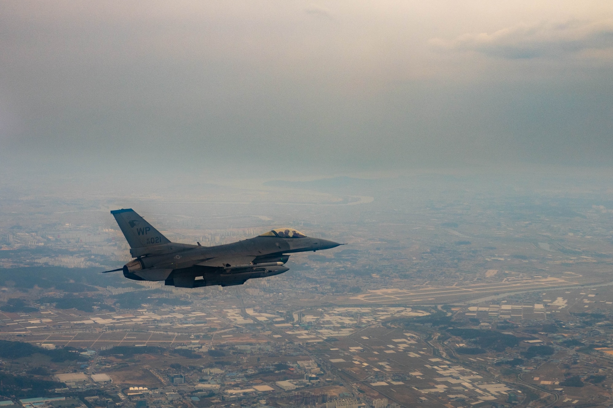 An F-16 Fighting Falcon piloted by Col. John D. Caldwell, vice commander 8th Fighter Wing, prepares to land at Osan Air Base, Republic of Korea, April 4, 2023. The F-16 Fighting Falcon is a highly maneuverable, multi-role fighter aircraft that provides a relatively low-cost, high-performance weapon system for the United States and allied nations. The Air Force Life Cycle Management Center has provided the F-16 fleet various modifications and upgrades since entering the Air Force inventory in 1979. The Post Block Integration Team (PoBIT) project is the most recent large-scale upgrade to the F-16, encompassing 22 combined modifications that increase survivability and accuracy of the weapon system. (U.S. Air Force photo by Captain Kaylin P. Hankerson)