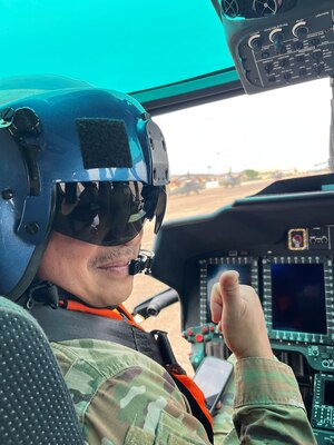 Brig Gen Canlas in a helicopter wearing a helmet