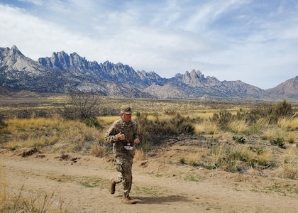 zCol. Brian Coleman, Oklahoma Army National Guard, competes in the military light division at the 2023 Bataan Memorial Death March at White Sands Missile Range, New Mexico, March 19, 2023. Coleman competed in the military light division, which is 26.2 miles in a full military uniform and finished 7th overall with a time of 5:59:51. (U.S. National Guard photo by Sgt. Gauret Stearns)