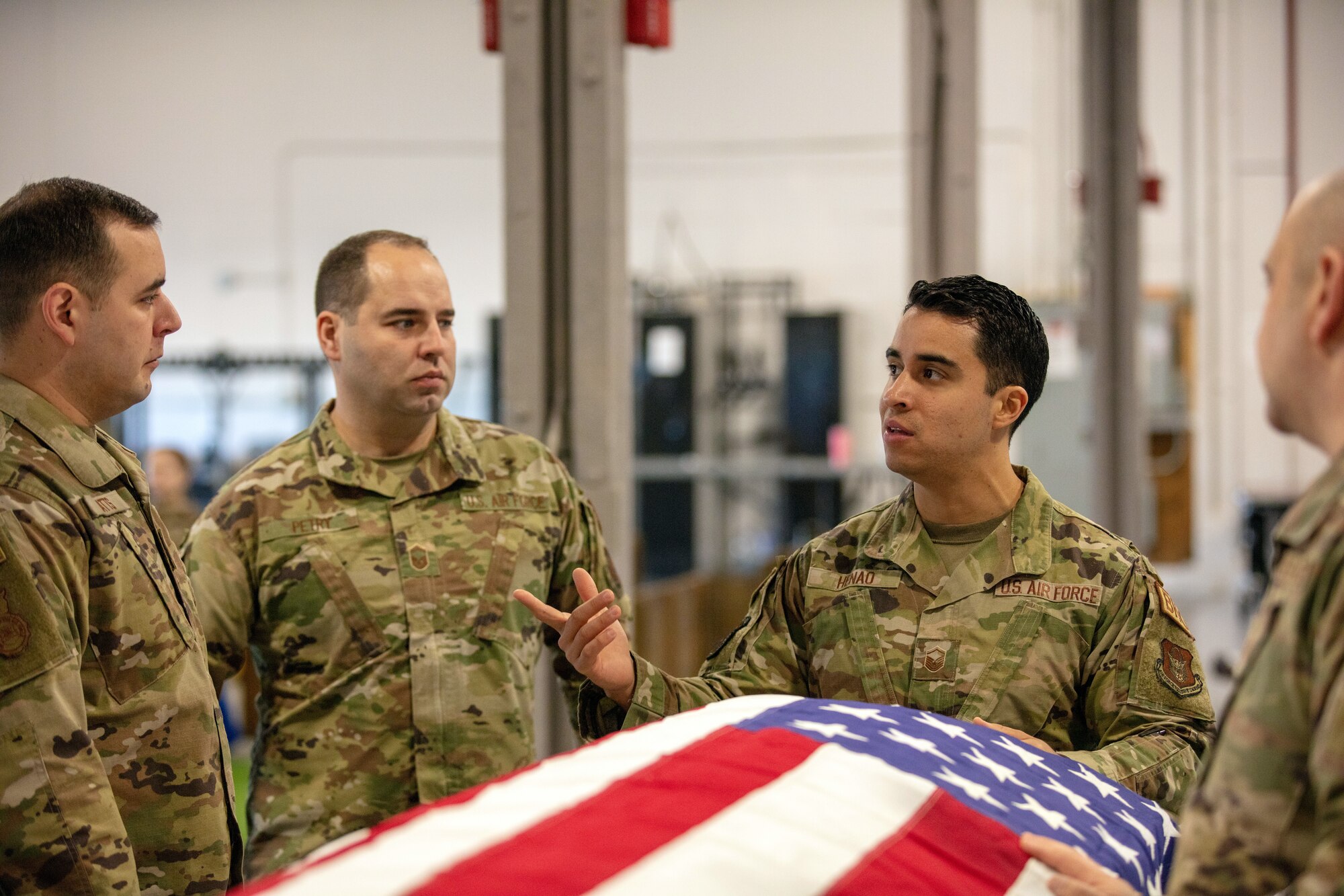 Master Sgt. Felipe Henao, center right, 445th Base Honor
Guard program manager, provides refresher training on
military funeral honors to honor guard members during
Train the Trainer at Wright-Patterson Air Force Base,
Ohio, March 15, 2023. The Airmen support the WPAFB
Honor Guard across six states when needed.