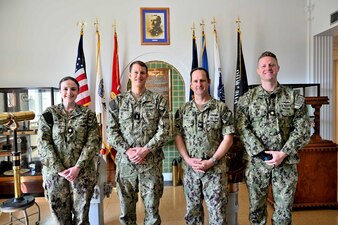 Cmdr. Colleen Hanbury, commanding officer, Navy Information Operations Center Pensacola, Rear Adm. Mike Studeman, Commander, Office of Naval Intelligence, Capt. Chris Bryant, commanding officer, Center for Information Warfare Training (CIWT), and Lt. Cmdr. Kevin Furst, executive officer, Information Warfare Training Command Corry Station, posed for a photo during Studeman’s visit to CIWT headquarters on Mar. 30, 2023.