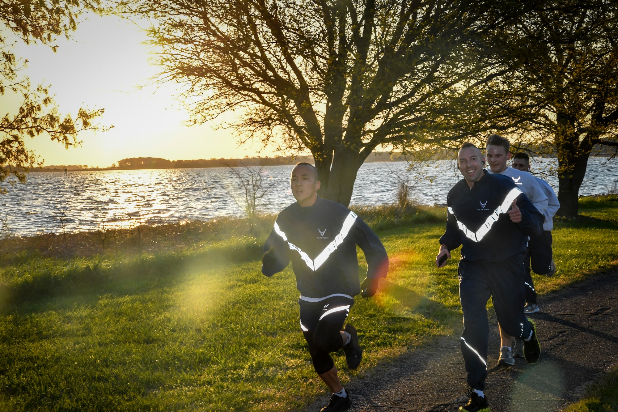 Photo of a few people running.