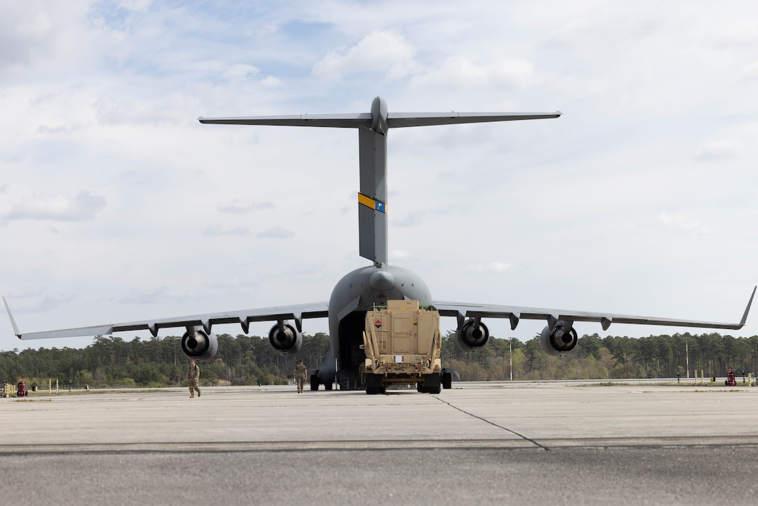 U.S. Marines with Combat Logistics Company 21, Marine Corps Air Station (MCAS) Cherry Point, North Carolina; U.S. Airmen with 16th Airlift Squadron, stationed at Charleston Air Force Base, South Carolina; and U.S. Soldiers with Battery B and Company E, 1st Battalion, 7th Air Defense Artillery stationed at Fort Bragg, North Carolina, load a heavy expanded mobility tactical truck onto a C-17 Globemaster III during exercise Operation Panther Talon at MCAS Cherry Point, North Carolina, March 31, 2023. MCAS Cherry Point’s training facilities, special-use air space, and proximity to Fort Bragg and Seymour Johnson Air Force Base allows the execution of expeditionary deployment operations to maintain and ensure mission readiness and strengthen joint service relations. (U.S. Marine Corps photo by Lance Cpl. Lauralle Walker)