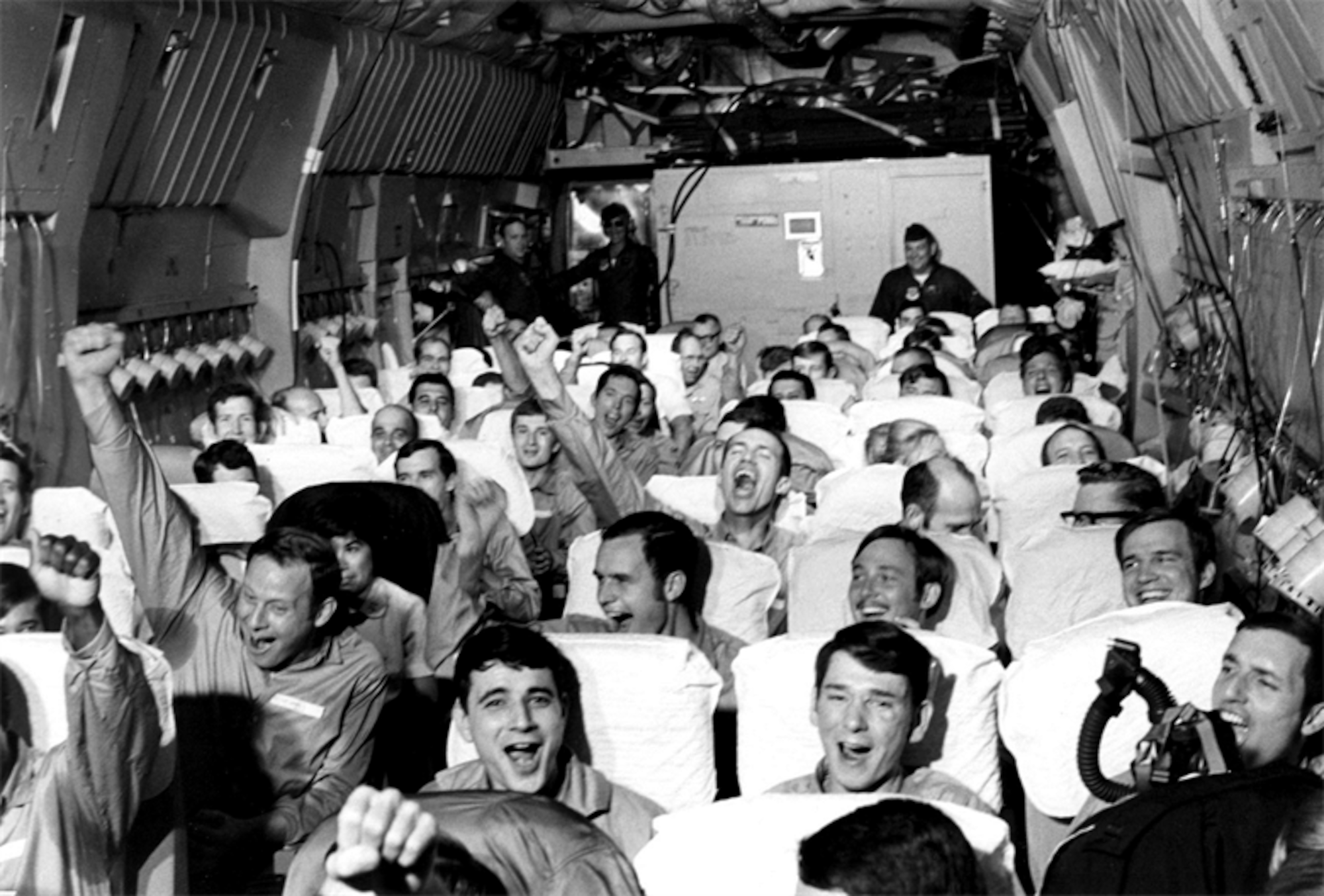 American returnees celebrate their departure from Hanoi.