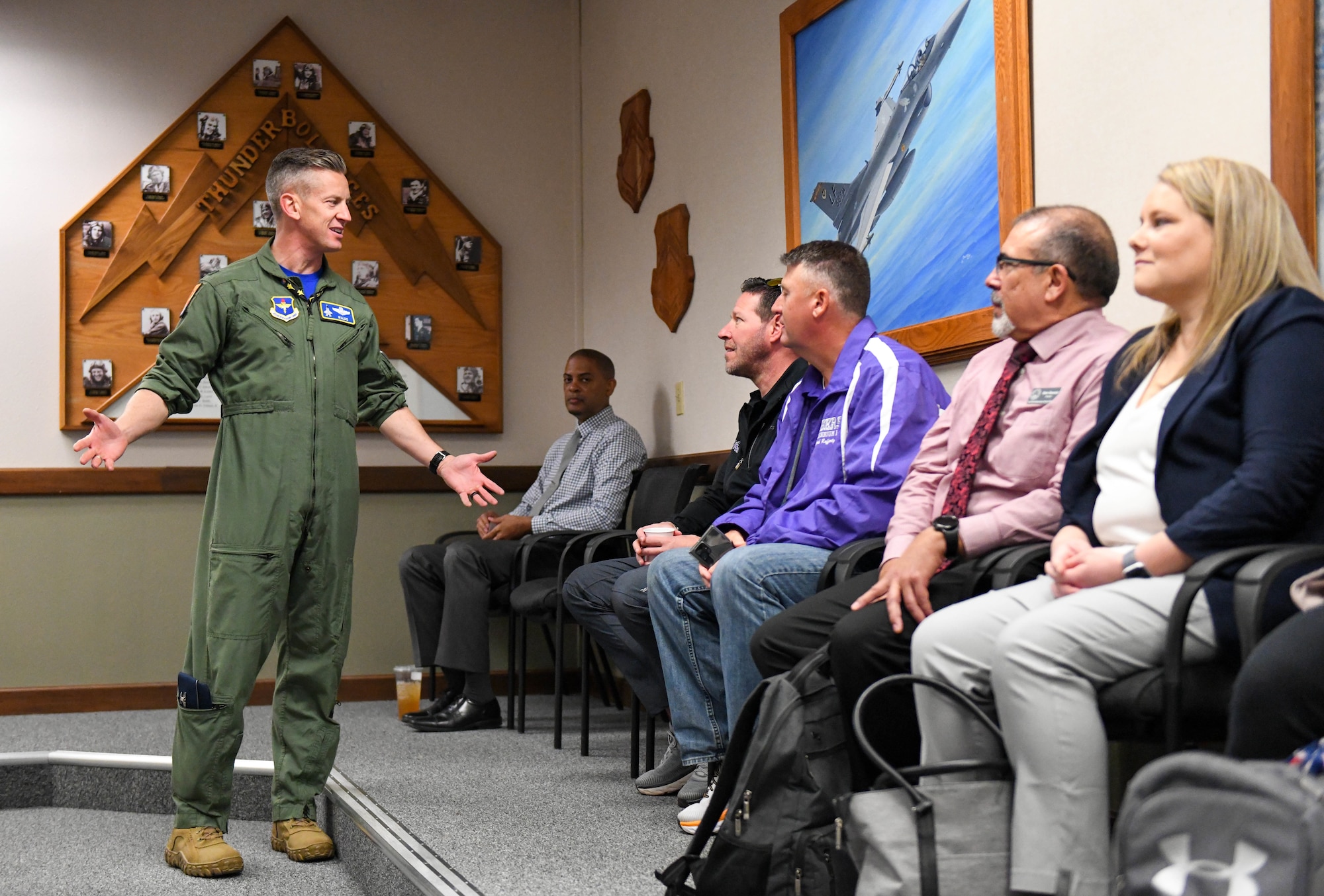 U.S. Air Force Col. Keegan McLeese, 56th Fighter Wing vice commander, speaks to West Valley educators, during the West Valley Educators Immersion Tour, March 31, 2023, Luke Air Force Base, Arizona.