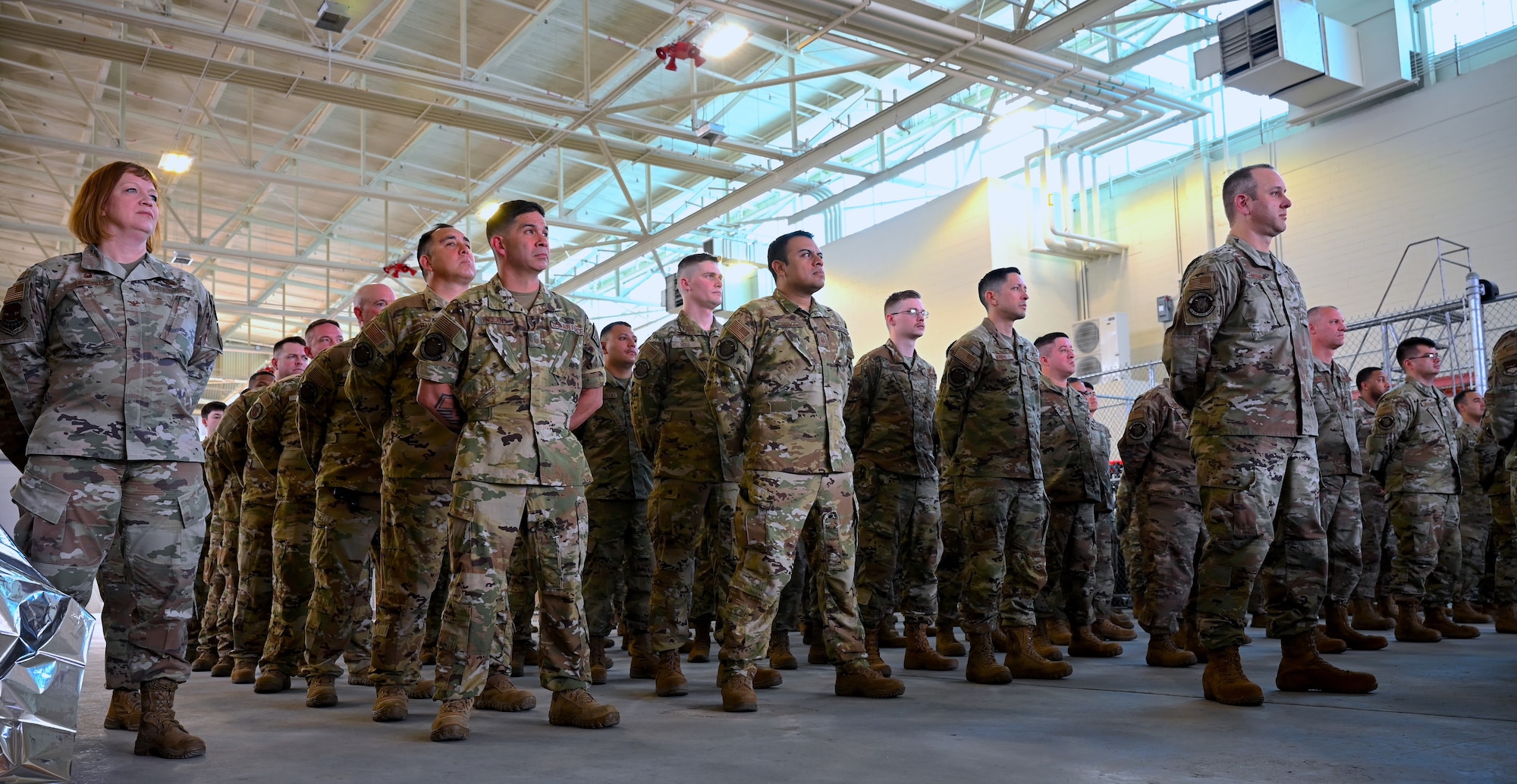 Col. Jeanne Bisesi, 433rd Mission Support Group commander, stands in formation alongside 433rd Civil Engineer Squadron Airmen as they listen to opening remarks of the assumption of command ceremony at Joint Base San Antonio-Lackland, Texas, April 1, 2023.