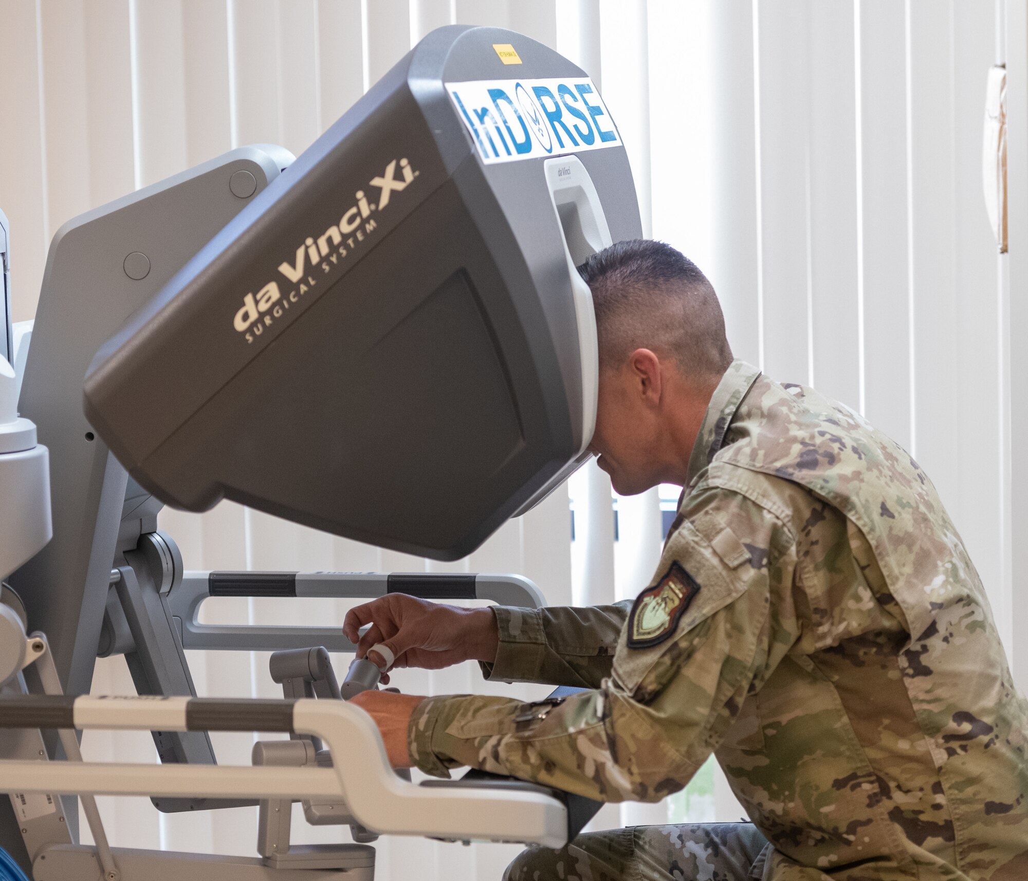 U.S. Air Force Col. Billy Pope, 81st Training Wing commander, operates the Da Vinci Xi during the 81st Medical Group Immersion Tour inside the Keesler Medical Center at Keesler Air Force Base, Mississippi, April 3, 2023.