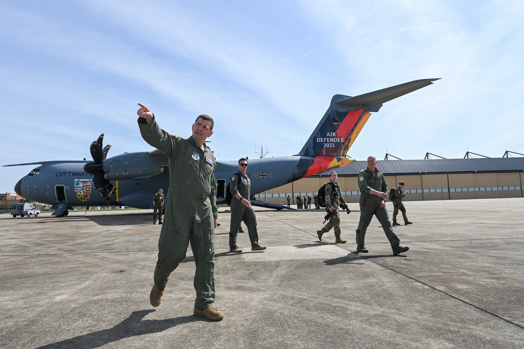 U.S. Air Force Lt. Gen. Michael Loh, front center, director, Air National Guard, tours the flightline during Air Defender 2023 Media Day, Joint Base Andrews, Maryland, April 4, 2023.