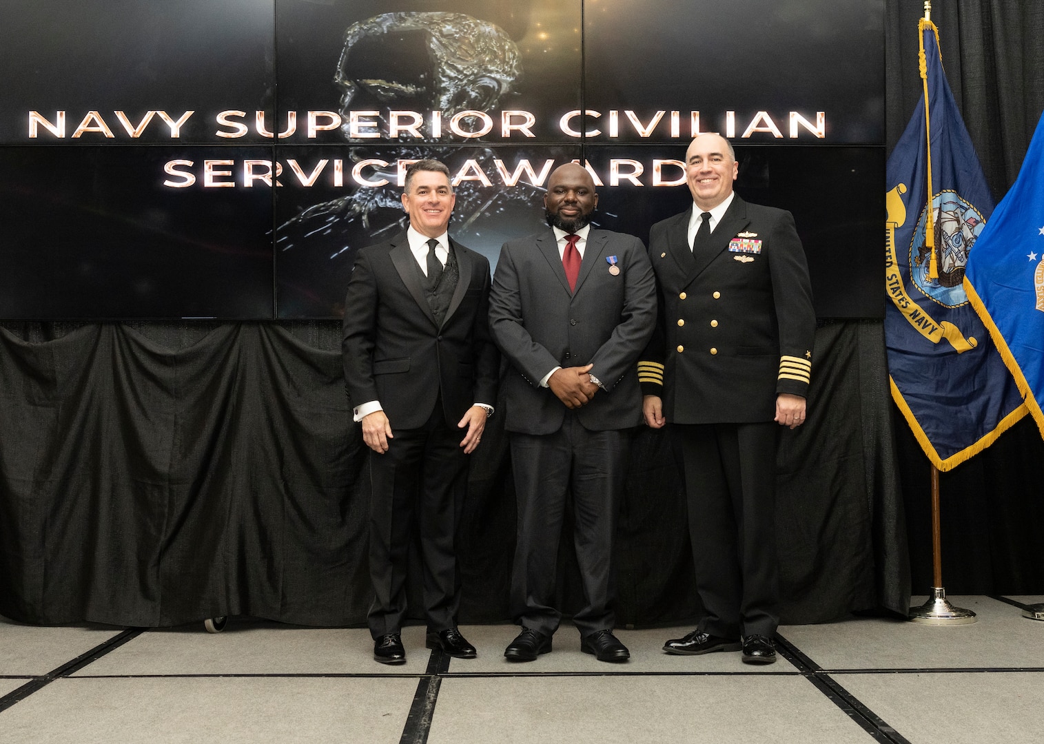 IMAGE: Naval Surface Warfare Center Dahlgren Division (NSWCDD) Technical Director Dale Sisson Jr., SES, and Commanding Officer Capt. Philip Mlynarski presented Willie Crank with the Navy Meritorious Civilian Service Award during the NSWCDD Annual Honorary Awards ceremony at the Fredericksburg Expo & Conference Center March 10.