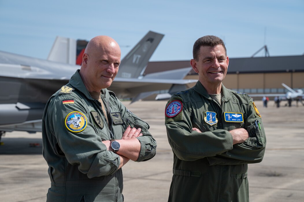German Lt. Gen. Ingo Gerhartz, left, chief of the German air force, poses for a photo with U.S. Air Force Lt. Gen. Michael A. Loh, director, Air National Guard, during a media event highlighting Air Defender 2023 on the flight line at Joint Base Andrews, Maryland, April 5, 2023.