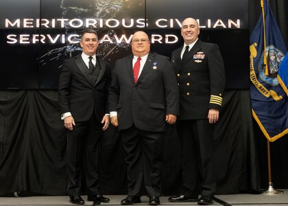 IMAGE: Naval Surface Warfare Center Dahlgren Division (NSWCDD) Technical Director Dale Sisson Jr., SES, and Commanding Officer Capt. Philip Mlynarski presented Scott Larimer with the Navy Meritorious Civilian Service Award during the NSWCDD Annual Honorary Awards ceremony at the Fredericksburg Expo & Conference Center March 10.