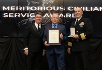 IMAGE: Naval Surface Warfare Center Dahlgren Division (NSWCDD) Technical Director Dale Sisson Jr., SES, and Commanding Officer Capt. Philip Mlynarski presented James McConkie with the Navy Meritorious Civilian Service Award during the NSWCDD Annual Honorary Awards ceremony at the Fredericksburg Expo Center March 10.