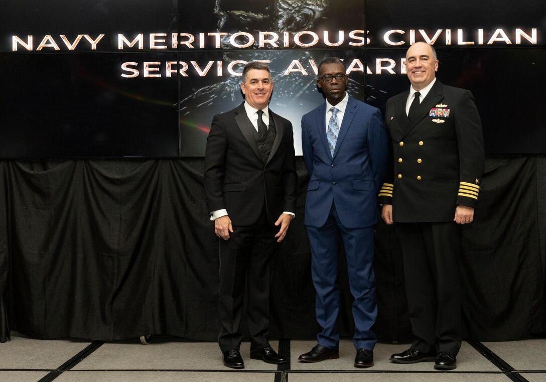 IMAGE: Naval Surface Warfare Center Dahlgren Division (NSWCDD) Technical Director Dale Sisson Jr., SES, and Commanding Officer Capt. Philip Mlynarski presented Ernest Yelder with the Navy Meritorious Civilian Service Award during the NSWCDD Annual Honorary Awards ceremony at the Fredericksburg Expo & Conference Center March 10.