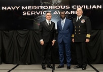 IMAGE: Naval Surface Warfare Center Dahlgren Division (NSWCDD) Technical Director Dale Sisson Jr., SES, and Commanding Officer Capt. Philip Mlynarski presented Ernest Yelder with the Navy Meritorious Civilian Service Award during the NSWCDD Annual Honorary Awards ceremony at the Fredericksburg Expo & Conference Center March 10.