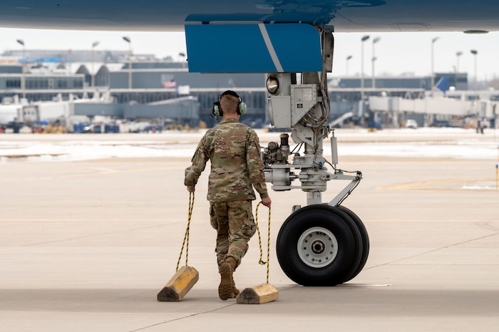 Airman 1st Class Jaxon Jeffries, 934th Aircraft Maintenance Squadron crew chief, walks toward Air Force One at Minneapolis-St. Paul Air Reserve Station, April 3, 2023. (U.S. Air Force photo by Master Sgt. Trevor Saylor)
