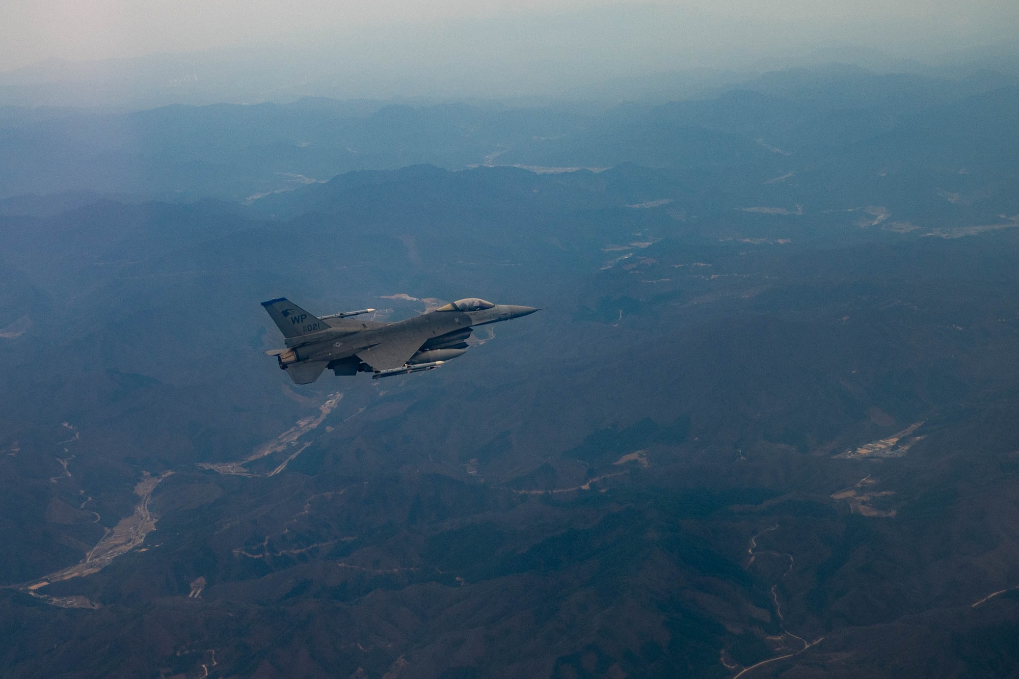 An F-16 Fighting Falcon assigned to the 8th Fighter Wing, Kunsan Air Base, Republic of Korea, flies over the Korean Peninsula, April 4, 2023. The F-16 entered the U.S Air Force inventory in 1979 and since has undergone a number of modernization efforts; most recently the Air Force Life Cycle Management Center began providing F-16s Post Block Integration Team (PoBIT) upgrades. PoBIT combines 22 various upgrades to the F-16’s avionics, improving the weapon systems lethality. (U.S. Air Force photo by Captain Kaylin P. Hankerson)