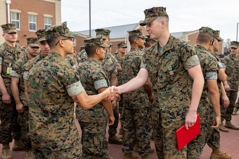 U.S Marine Corps Corporal Bradley Feldkamp, a motor transport operator attending Marine Security Guard School at Marine Corps Embassy Security Group, shakes hands with Marines after receiving the Navy and Marine Corps Achievement Medal for heroic acts performed while off-duty after an awards ceremony on Quantico, Virginia, April 6, 2023. Feldkamp and two other Marines received the award after intervening during an altercation between civilians involving a knife. The Marines successfully deescalated the situation, recovered the weapon and restrained the perpetrators until the police arrived on scene. (U.S. Marine Corps photos by Cpl. Keegan Bailey)