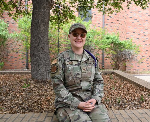 U.S. Air Force Staff Sgt. Seraiah Wolf, 17th Civil Engineer Squadron Airman dorm leader, smiles at Goodfellow Air Force Base, Texas, April 6, 2023. Wolf has been an Airman dorm leader since 2021. (U.S. Air Force photo by Airman 1st Class Madison Collier)