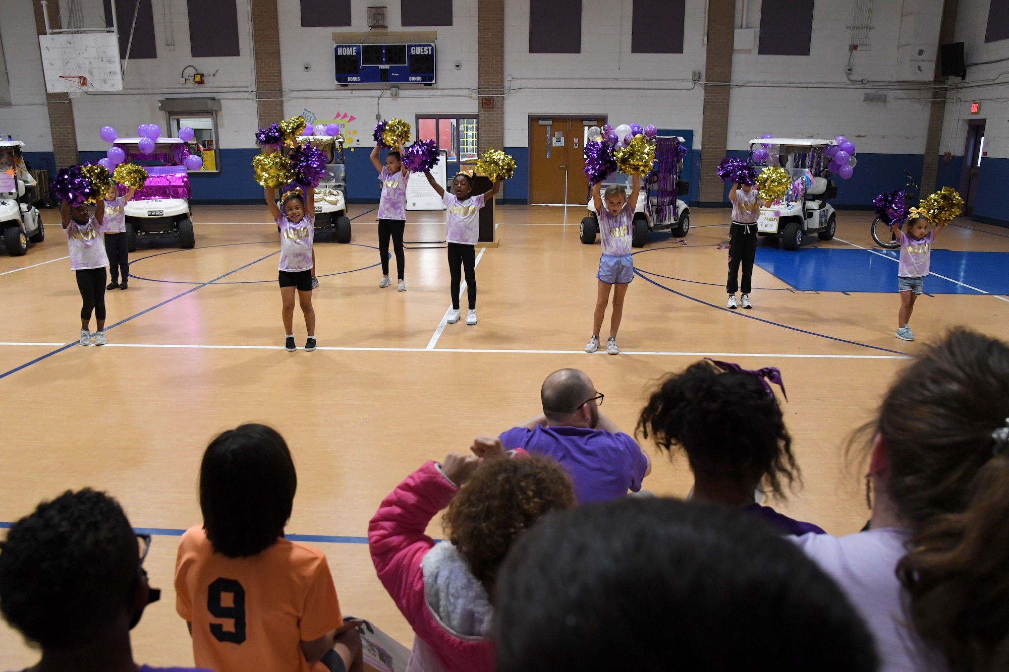 Keesler children participate in a cheer during a pep rally inside the Youth Center at Keesler Air Force Base, Mississippi, April 7, 2023.