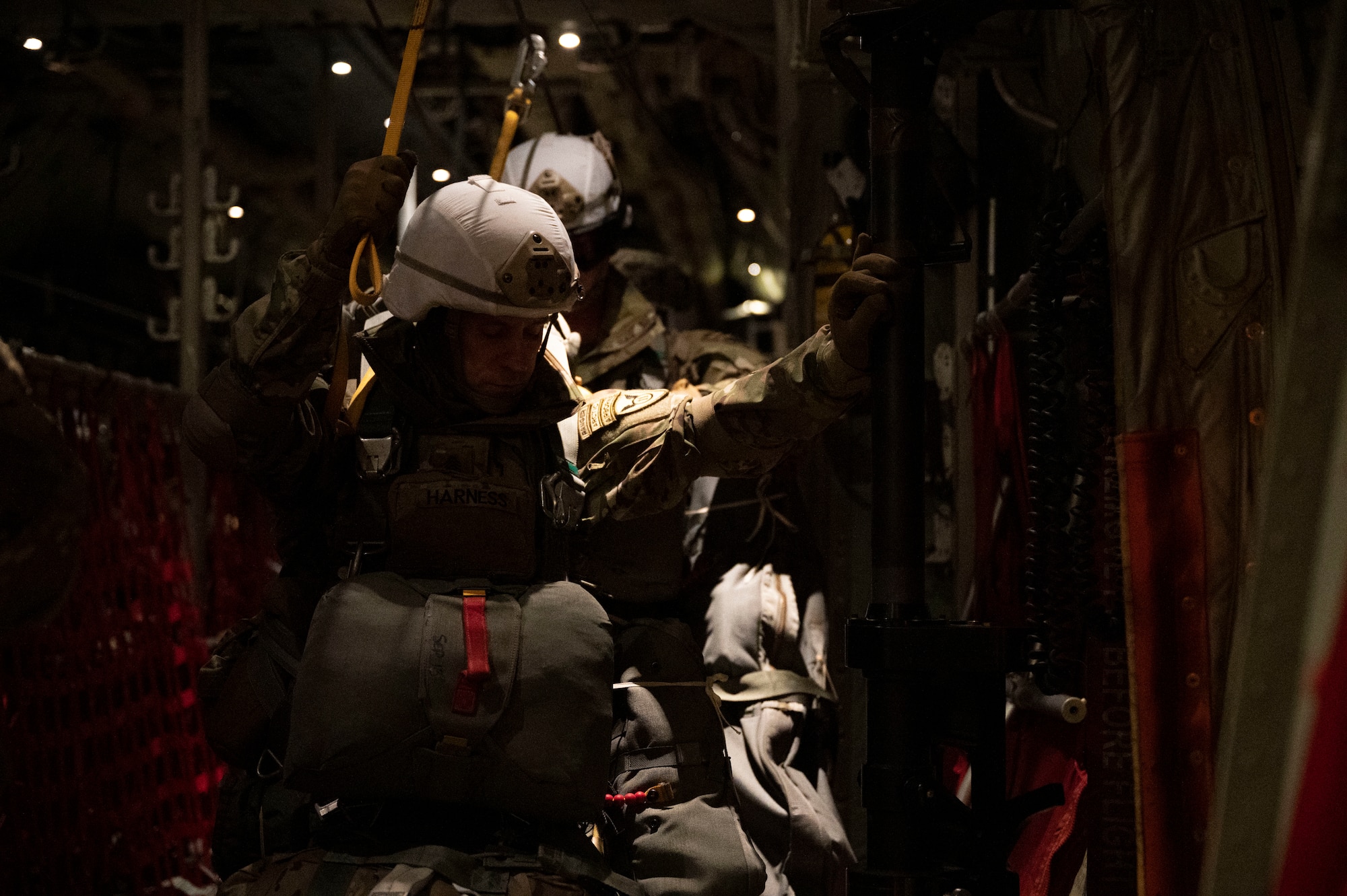 U.S. Army Airborne personnel wait to jump out of a C-130J Super Hercules