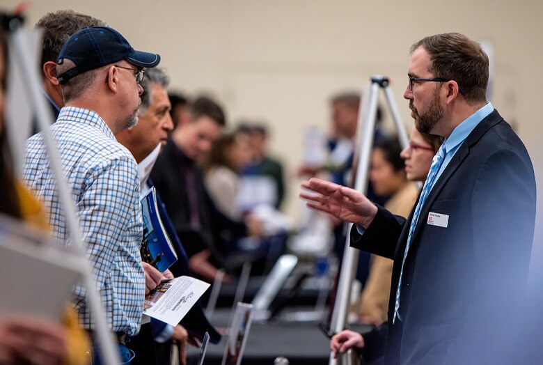 Representatives from regional large and small businesses speak with U.S. Army Corps of Engineers-Albuquerque District personnel about USACE projects during a Business Opportunities Open House at the Albuquerque Convention Center, March 30, 2023.