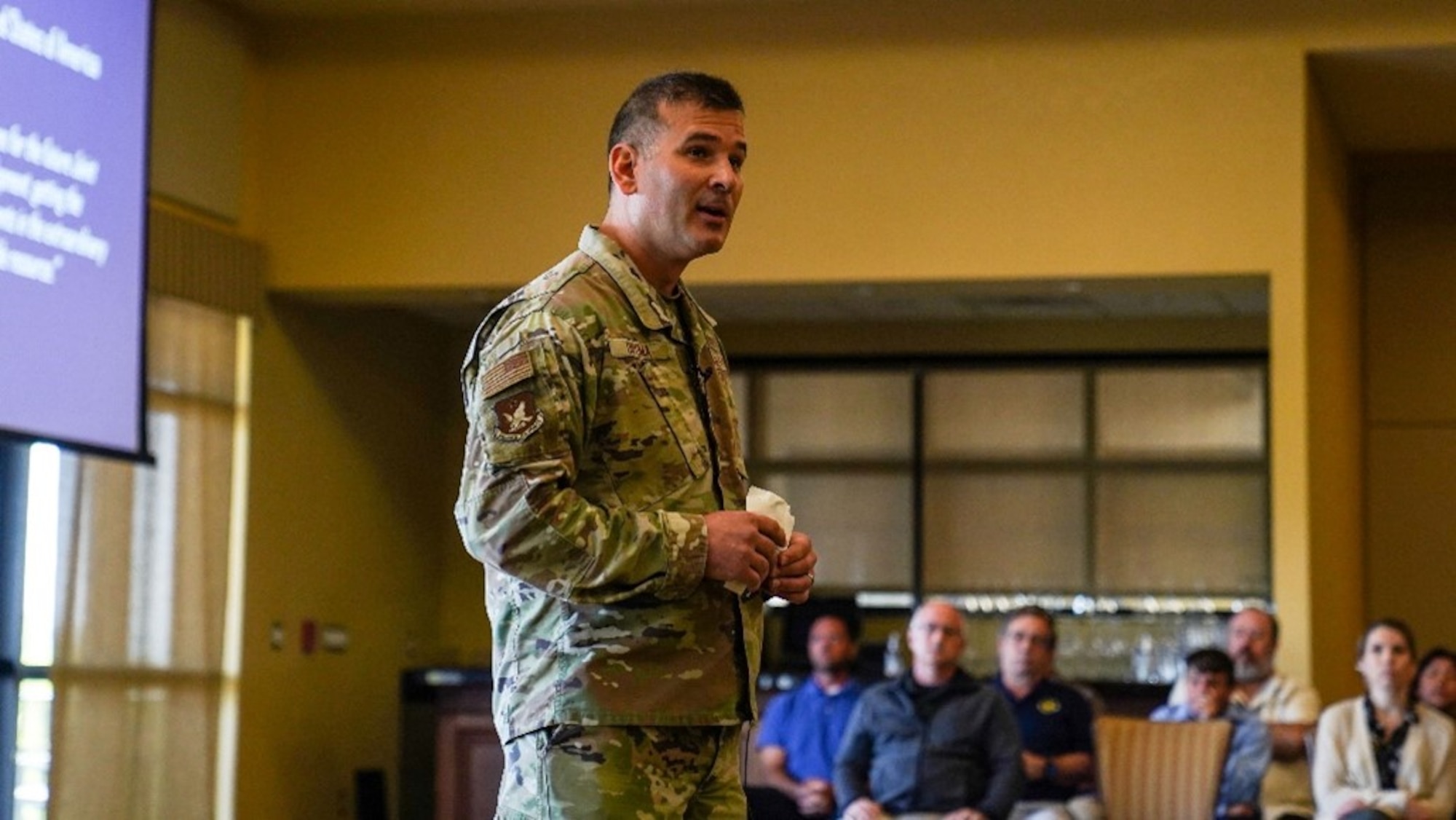 U.S. Air Force Col. Nicholas Dipoma, Second Air Force vice commander, briefs 81st Training Wing leadership and virtual attendees at the Bay Breeze Event Center on Keesler Air Force Base, Mississippi, March 22, 2023