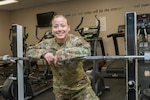 Staff Sgt. Caley Arndt, a services specialist for the 167th Force Support Squadron, stands in the gym at the 167th Airlift Wing, April 2, 2023. Arndt competed in the 2023 CrossFit Games Quarterfinals in March earning a worldwide ranking of 702.