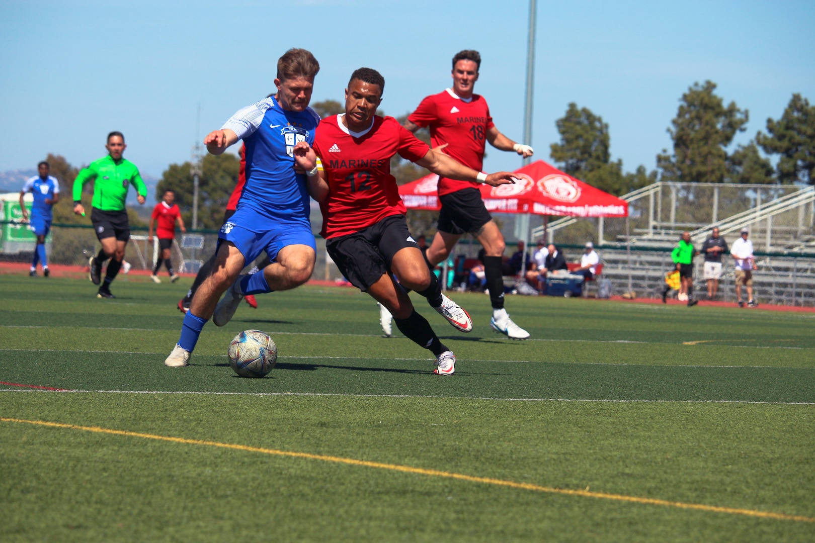 Air Force 1st Lt. Austin Dewing of Hurlburt Field, Florida and Marine Corps 1st Lt. Randall McDermott of MCB Camp Pendleton, Calif. battle for ball control during match 4 featuring USMC v USAF of the 2023 Armed Forces Men’s Soccer Championship held at the Paige Fieldhouse Marine Corps Base Camp Pendleton, California on 7 April 2023.  The Armed Forces Men's Soccer Championship hosted by Marine Corps Base Camp Pendleton, California from April 4-11.  The Armed Forces Championship features teams from the Army, Marine Corps, Navy (with Coast Guard runners), and Air Force (with Space Force Runners).  Department of Defense Photo by Mr. Steven Dinote - Released.