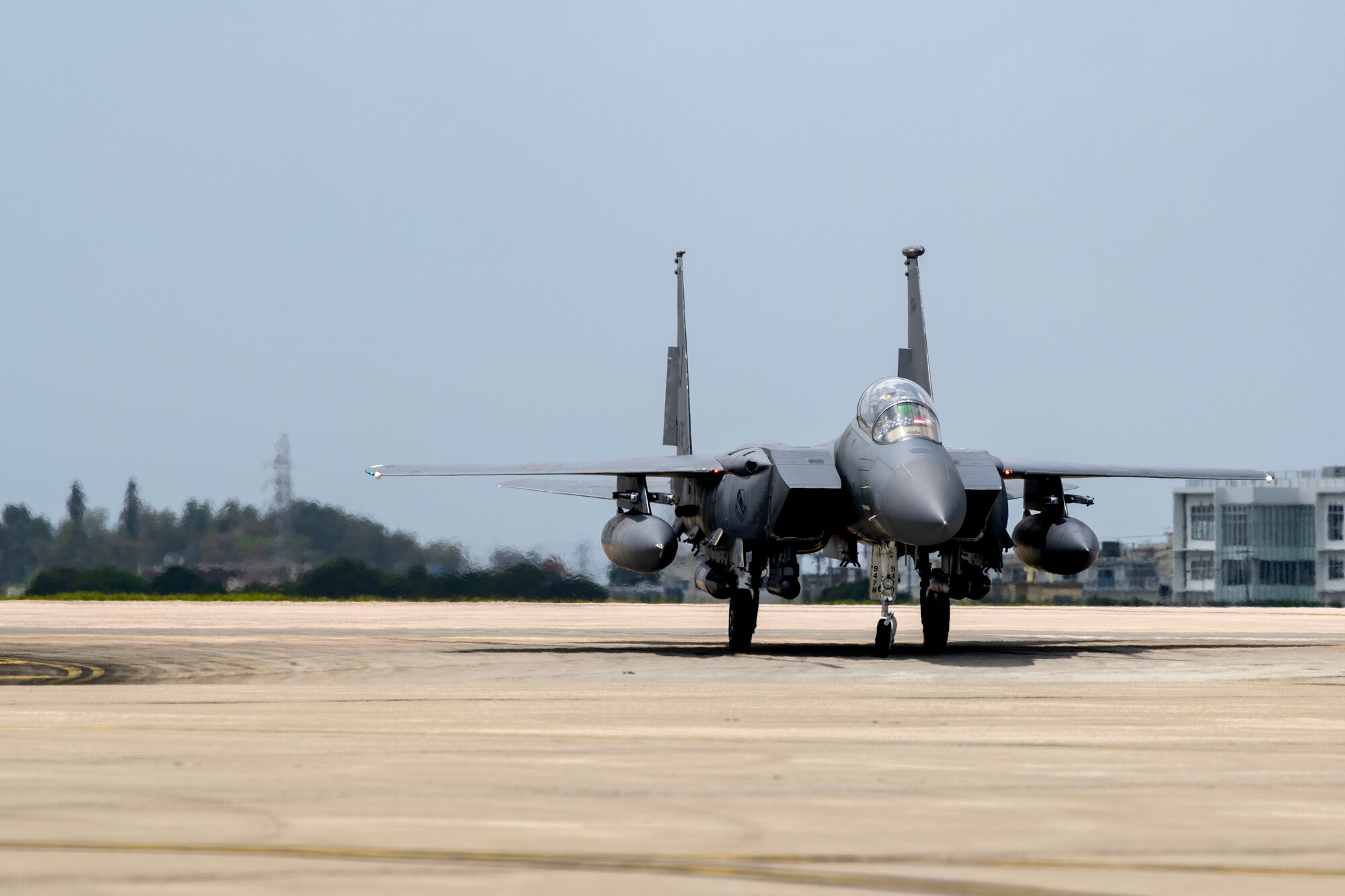An F-15E Strike Eagle assigned to the 336th Fighter Squadron arrives at Kadena Air Base, Japan, April 8, 2023. The Strike Eagle will work in conjunction with F-35A Lightning II aircraft deployed from Eielson Air Force Base and remaining F-15C/D Eagles at Kadena Air Base to ensure continued steady-state fighter capabilities in the region. (U.S. Air Force photo by Senior Airman Jessi Roth)