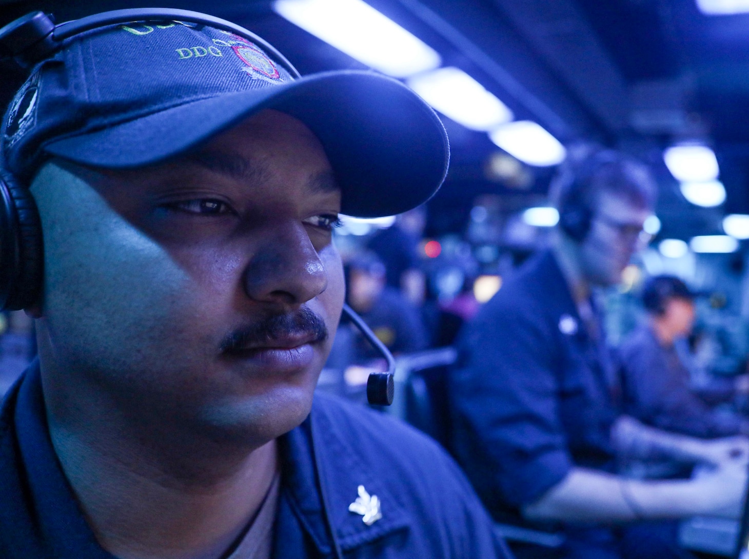 Fire Controlman (Aegis) 2nd Class Ordermos Ford, from Muscatine, Iowa, stands watch in the combat information center aboard the Arleigh Burke-class guided-missile destroyer USS Milius (DDG 69) while conducting routine underway operations. Milius is forward-deployed to the U.S. 7th Fleet area of operations in support of a free and open Indo-Pacific.