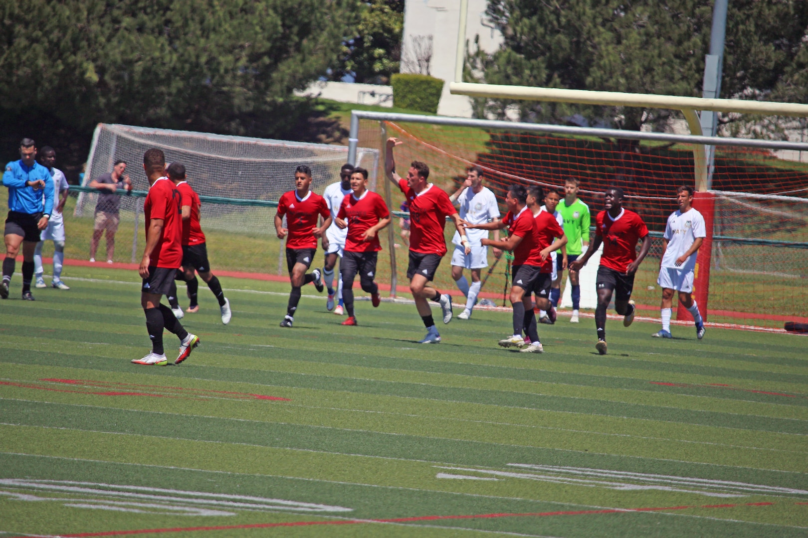 Marine Staff Sgt. Stephen Whisnant of MCB Camp Pendleton, Calif. scores the Marines' first goal of match 5 featuring USMC v Navy of the 2023 Armed Forces Men’s Soccer Championship held at the Paige Fieldhouse Marine Corps Base Camp Pendleton, California on 9 April 2023.  The Armed Forces Men's Soccer Championship hosted by Marine Corps Base Camp Pendleton, California from April 4-11.  The Armed Forces Championship features teams from the Army, Marine Corps, Navy (with Coast Guard runners), and Air Force (with Space Force Runners).  Department of Defense Photo by Mr. Steven Dinote - Released.