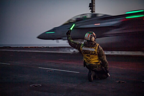 An F/A-18F Super Hornet from the "Fighting Redcocks" of Strike Fighter Squadron (VFA) 22 launches off USS Nimitz (CVN 68).