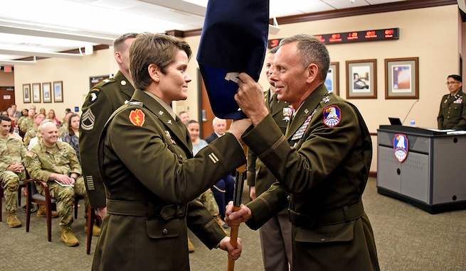 Col. Andrew Morgan relinquishes command of the Army NASA Detachment to Col. Anne McClain during a ceremony at the U.S. Army Space and Missile Defense Command’s Redstone Arsenal, Alabama, headquarters on April 4. (photos by Carrie David Campbell)