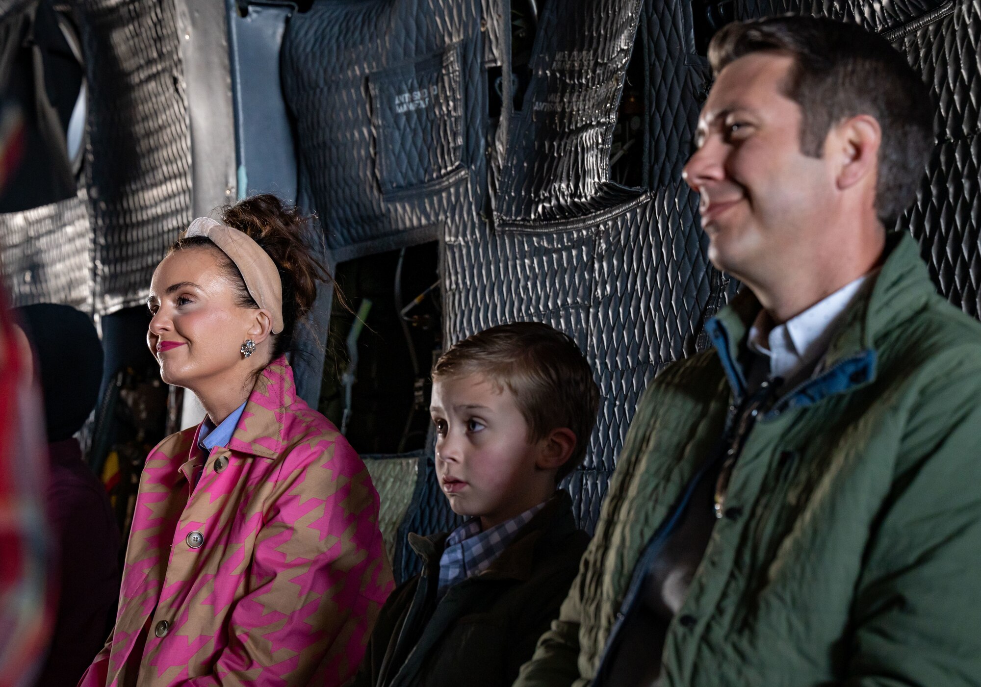 Team Dover members smile during a sermon on a C-5M Super Galaxy at Dover Air Force Base, Delaware, April 9, 2023. For the first time since the COVID-19 pandemic, the 436th Airlift Wing Chapel team hosted 130 Team Dover members aboard a C-5 for a religious service. (U.S. Air Force photo by Airman 1st Class Amanda Jett)