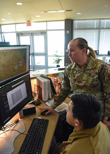Senior Airman Christina Long, 5th Operations Support Squadron weather forecaster, checks a weather radar at Minot Air Force Base, North Dakota, April 7, 2023. Countless factors can contribute to the outcome of a mission. It’s the job of weather specialists to keep a constant watch over the forecast and conditions that can affect the safety of pilots and aircrew.  (U.S. Air Force photo by Senior Airman Caleb S. Kimmell)