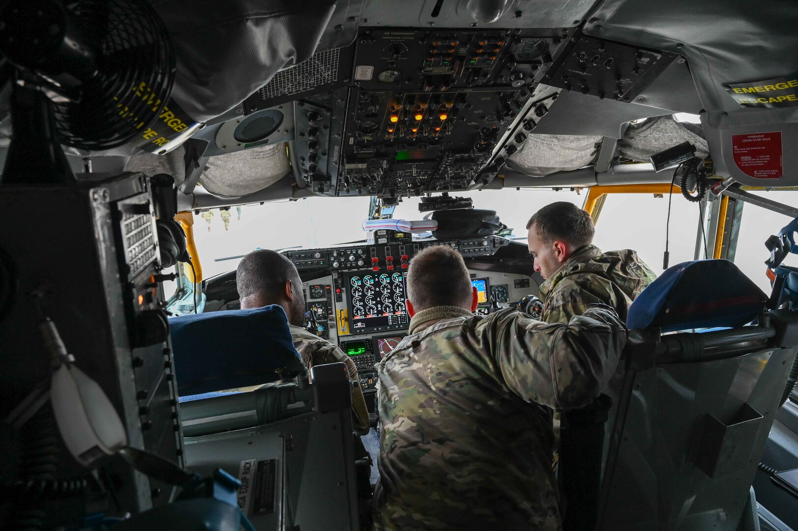 U.S. Air Force Capt. James Gill, 54th Air Refueling Squadron instructor pilot, explains the control panel of a KC-135 Stratotanker to students from the Career Enlisted Aviator Center for Excellence at Joint Base San Antonio-Lackland, Texas, April 6, 2023. Material management, loadmaster, and boom operator students from the CEA Center for Excellence were able to sit in the pilot and co-pilot's seat to see how the aircraft worked. (U.S. Air Force photo by Airman 1stClass Kari Degraffenreed)
