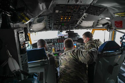 U.S. Air Force Capt. James Gill, 54th Air Refueling Squadron instructor pilot, explains the control panel of a KC-135 Stratotanker to students from the Career Enlisted Aviator Center for Excellence at Joint Base San Antonio-Lackland, Texas, April 6, 2023. Material management, loadmaster, and boom operator students from the CEA Center for Excellence were able to sit in the pilot and co-pilot's seat to see how the aircraft worked. (U.S. Air Force photo by Airman 1stClass Kari Degraffenreed)