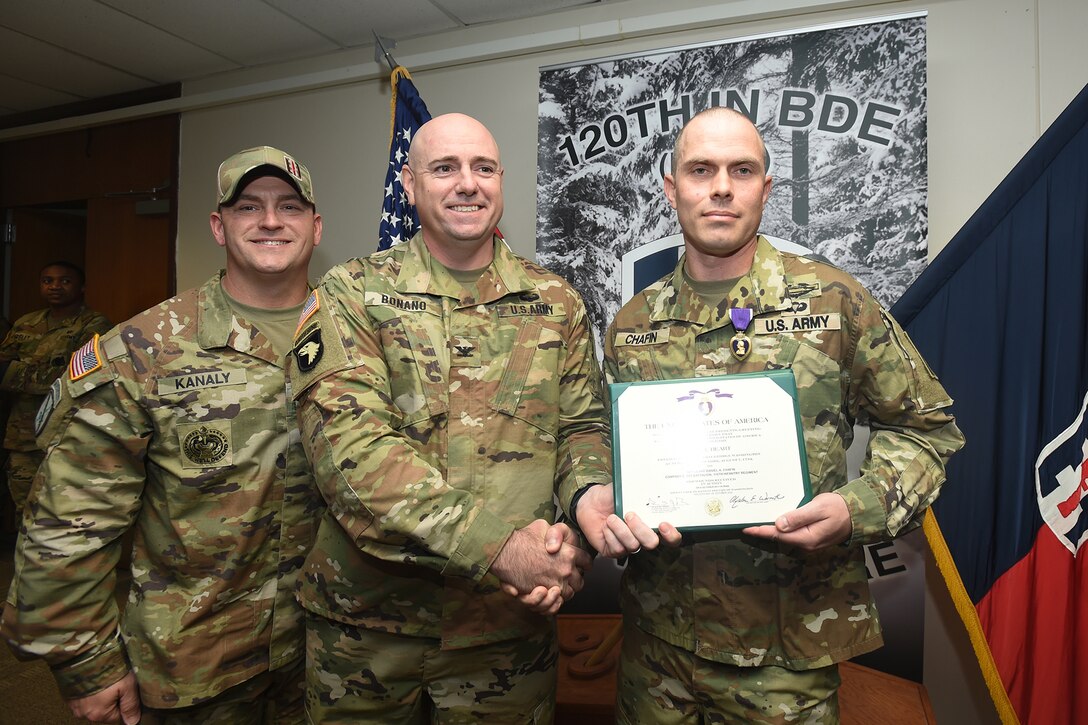 U.S. Army Reserve Master Sgt. Daniel Chafin, right, Mobilization Demobilization Operations Center Noncommissioned Officer in Charge, 2-360th Training Support Battalion, pauses for a photo with Col. Paul Bonano, center, Commander, 120th Infantry Brigade and Command Sgt. Major John Kanaly, Command Sergeant Major, 120th Infantry Brigade, April 05, 2023, at First Army Division West headquarters on Fort Hood, Texas.