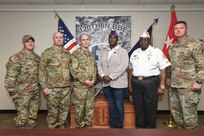 U.S. Army Reserve Master Sgt. Daniel Chafin, Mobilization Demobilization Operations Center Noncommissioned Officer in Charge, 2-360th Training Support Battalion, pauses for a photo with leaders from First Army Division West, 120th Infantry Brigade and the Military Order of the Purple Heart, April 05, 2023, at First Army Division West headquarters on Fort Hood, Texas.