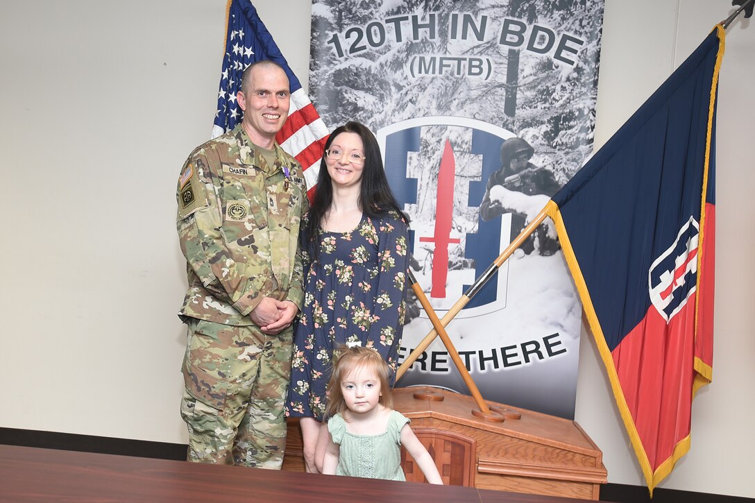 U.S. Army Reserve Master Sgt. Daniel Chafin, Mobilization Demobilization Operations Center Noncommissioned Officer in Charge, 2-360th Training Support Battalion, pauses for a photo with his family, April 05, 2023, at First Army Division West headquarters on Fort Hood, Texas.